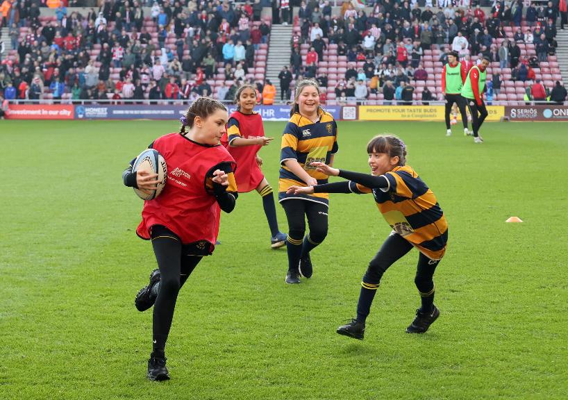 Houghton Rugby Club Under 14's Team on the pitch at SoL at fan zone takeover on 8.3.25 